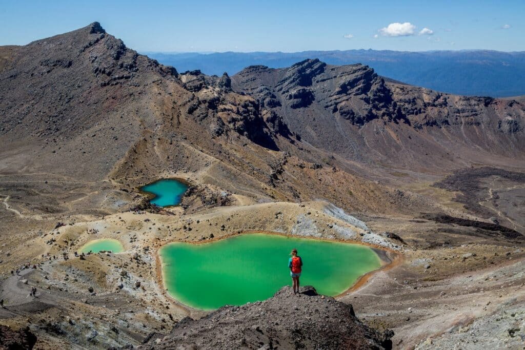 Colorful bright green, blue, and turquoise volcanic ponds in Tongariro National Park near Mount Ruapehu