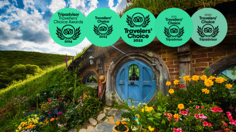 Hobbiton Movie Set tour scene with green hills and a Traveler’s Choice Award badge