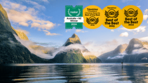 Milford Sound tour boat with award emblem for Best of the Best Tours