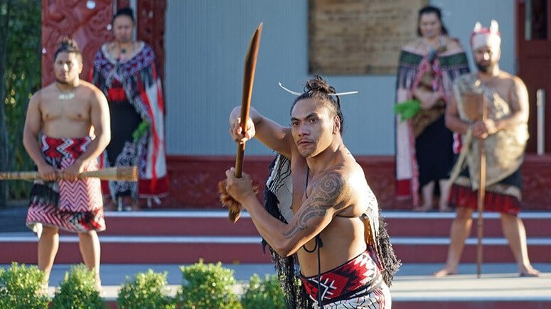 Māori performers in traditional dress performing the haka war dance at Te Puia Cultural Centre