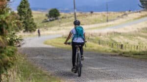 Riders exploring scenic gravel back roads on e-bikes