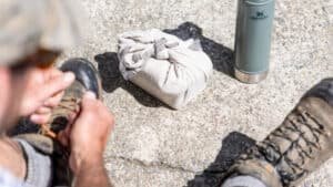 Guest tightening tramping boots before exploring trails at Blackburn Ridge Rural Retreat