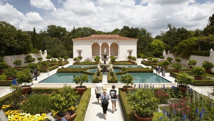 Formal Italian Renaissance garden with symmetrical hedges, statues, and classical architecture at Hamilton Gardens