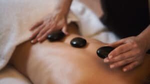 Guest receiving a soothing massage at Maruia River Retreat wellness center