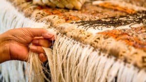 Expert demonstrating traditional Māori weaving techniques in Rotorua
