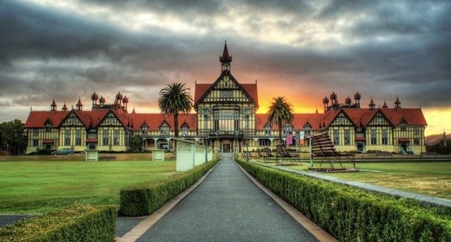 Historic building surrounded by lush gardens in Rotorua Government Gardens, New Zealand