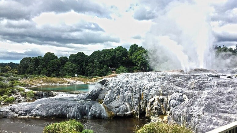 Powerful geysers erupting high into the air in Rotorua geothermal valley