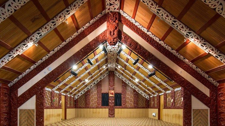 Intricately carved interior of a traditional Māori marae in Rotorua