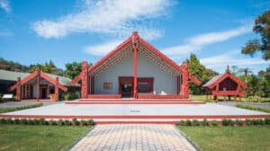 Traditional Māori marae with carved wooden details at Te Puia in Rotorua, New Zealand