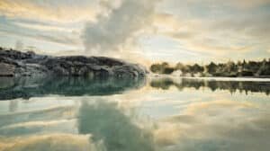 Steaming geothermal geysers in Rotorua with sulphur mist rising