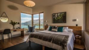 High-end eco-friendly king room featuring luxury interiors and scenic views at Aroha Wellness Retreat.