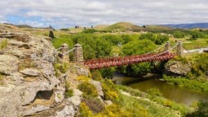 Historic Ophir Bridge spanning the Manuherikia River with Central Otago hills in the background