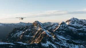 Scenic flight over snow-covered mountain peaks near Tasman Glacier on a helihike from Queenstown