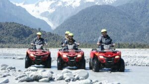 Group of quad bikes lined up and ready for an off-road adventure in Franz Josef.