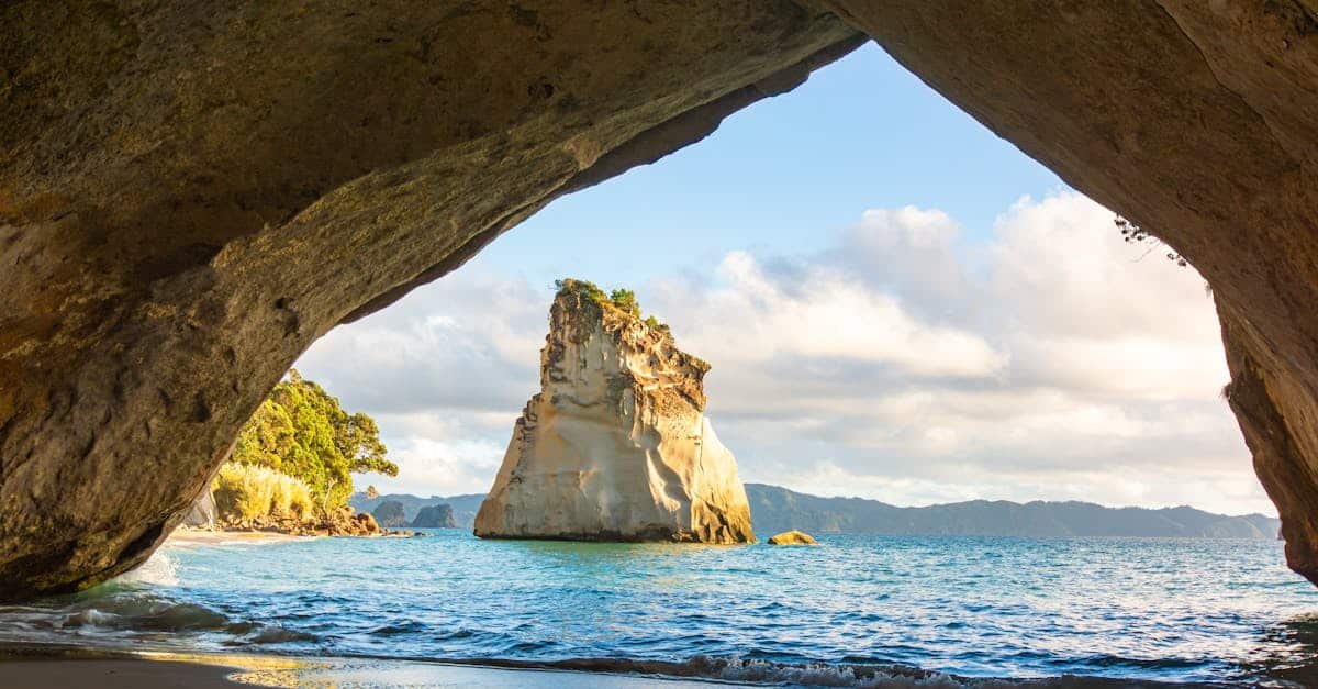 Cathedral Cove beach with iconic rock formations and clear blue waters in New Zealand
