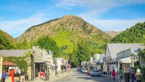 Charming Arrowtown main street lined with heritage shops on both sides.