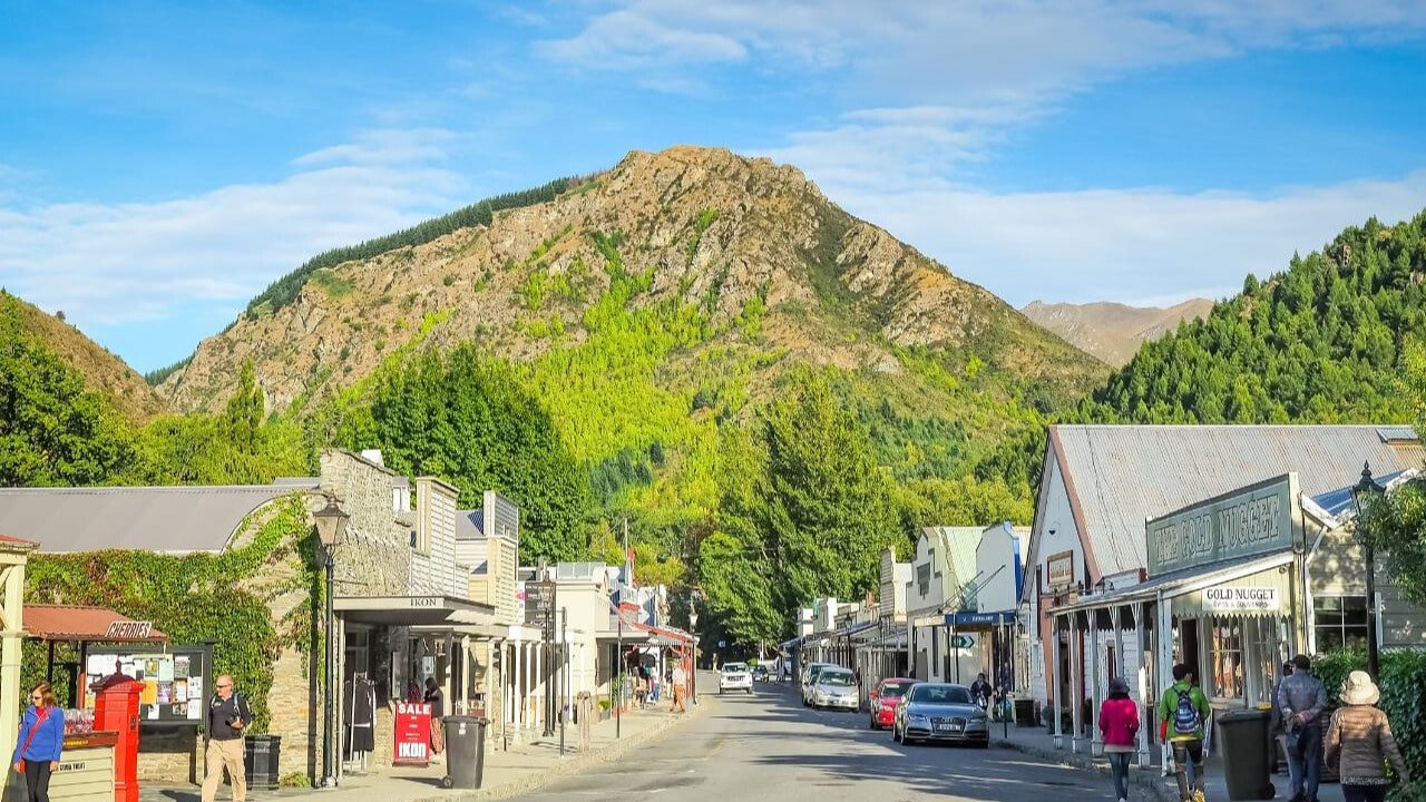 Charming Arrowtown main street lined with heritage shops on both sides.