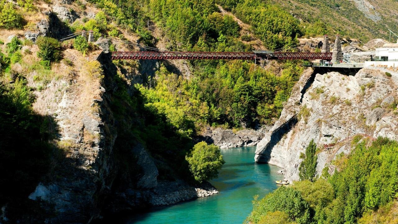 Historic bridge over a river set up for bungy jumping in Queenstown, New Zealand.