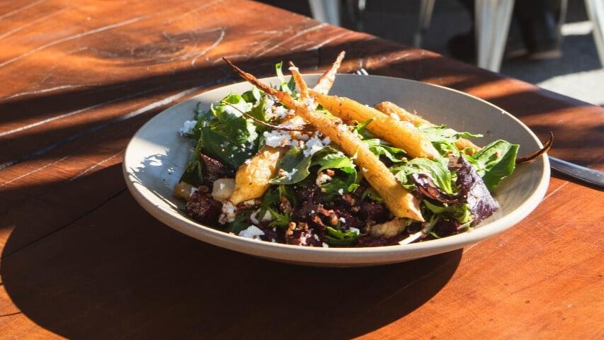 Fresh prawn and green salad served during lunch at Kinross Winery on the Queenstown Wine Sampler Tour.