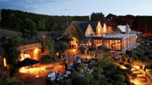 Candle-lit outdoor dining setup on Waiheke Island at night