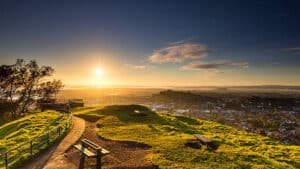Sunset over Auckland city skyline as seen from Mt Eden on a small group tour