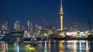 Night kayak tour with views of Auckland city lights and Sky Tower in the background