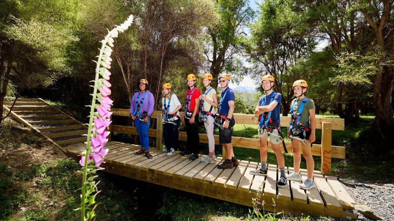 Group lining up in native bush ready for the EcoZip zipline tour in Kaikōura