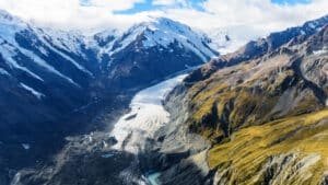 Bird’s-eye view of Mount Cook and surrounding landscapes from a helicopter on a small-group day tour from Christchurch via Tekapo