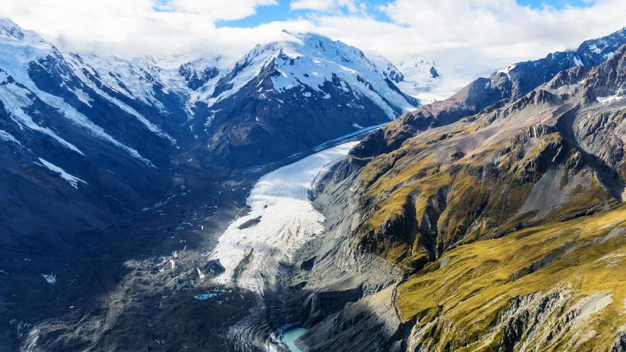 Bird’s-eye view of Mount Cook and surrounding landscapes from a helicopter on a small-group day tour from Christchurch via Tekapo
