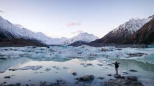 Icy lakes surrounded by snow-dusted mountains on Mount Cook scenic tour from Queenstown