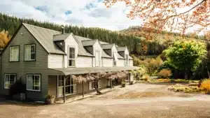 Exterior view of Maruia River Retreat building offering comfortable accommodation