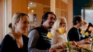 Guests sharing a communal meal at Aro Hā Wellness Retreat in New Zealand
