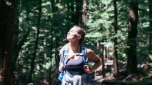 Guest walking through native bush on a mindful hike and forest bathing near Aro Hā Wellness Retreat, New Zealand