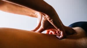 Close-up of hands giving a relaxing massage at Aro Hā Wellness Retreat in New Zealand
