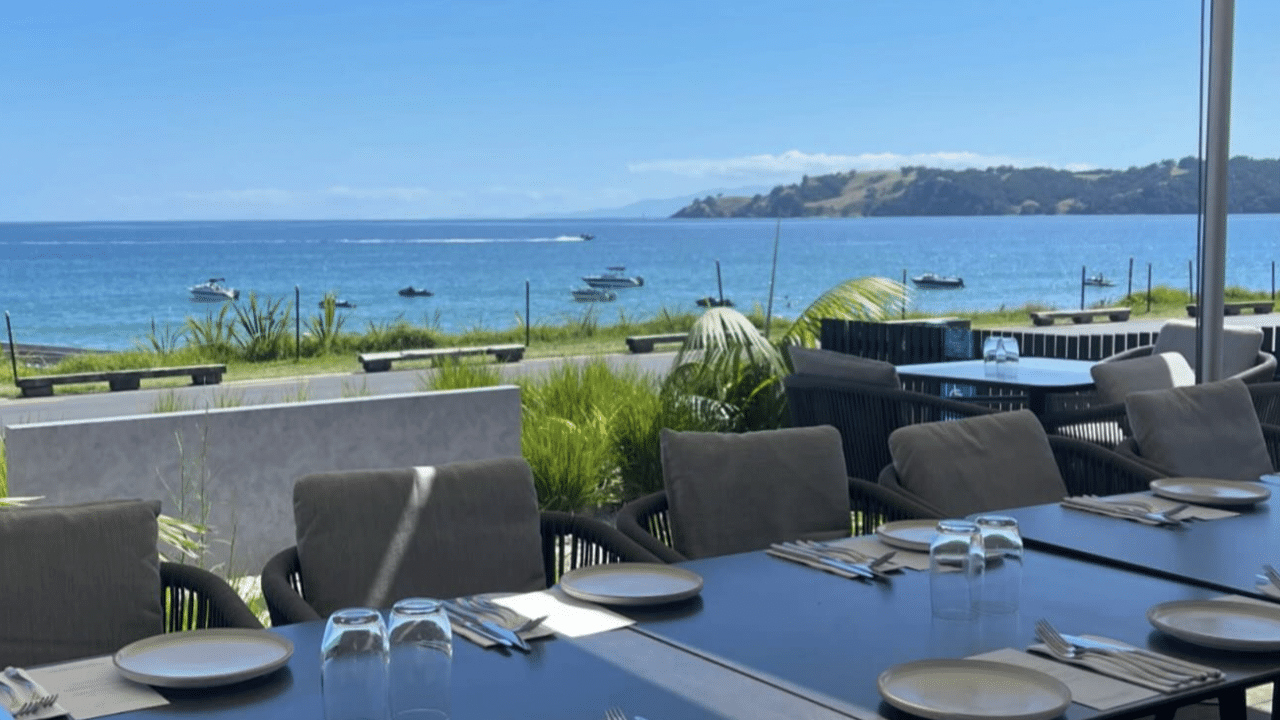 Boats on a sunlit bay viewed from Kimaha Restaurant on Waiheke Island